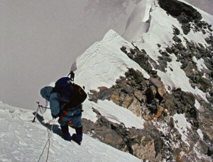 man walking in the snow