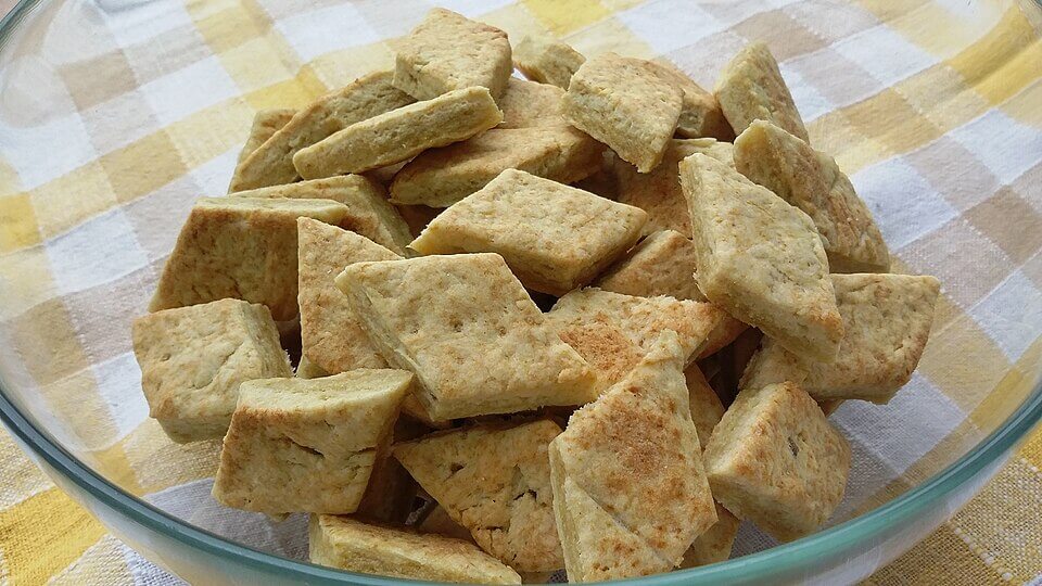 Triangle shaped Potato Biscuits inside a glass recipient