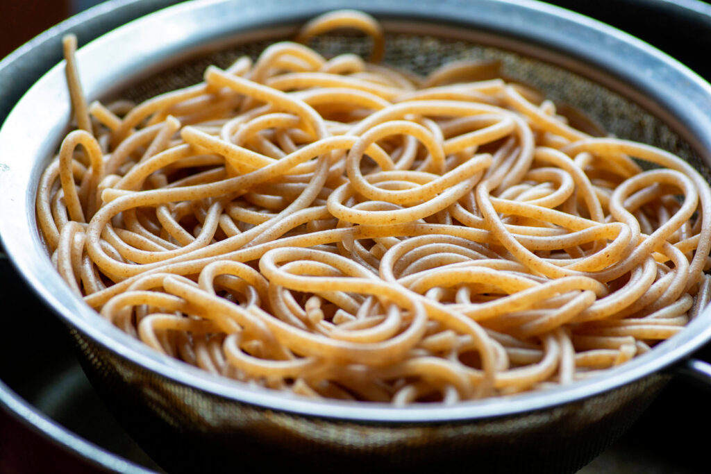Noodles made from wholewheat, buckwheat and quinoa flour on a plate